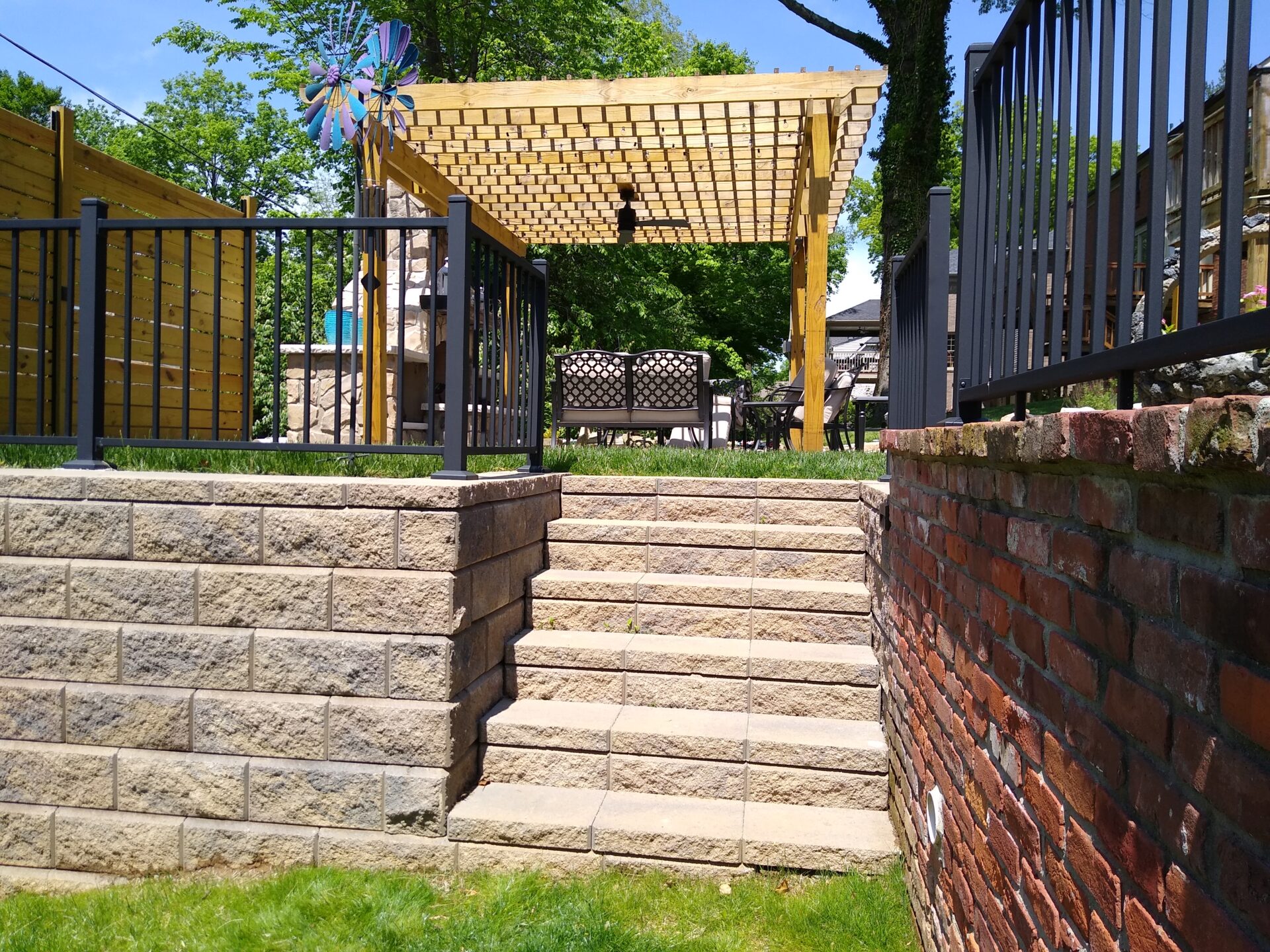 A wooden pergola over the top of steps.