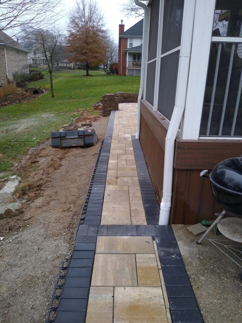 A walkway is being built in the backyard.